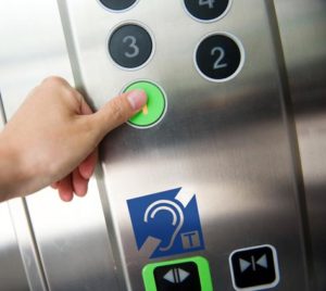 Hearing loop sign in lift elevator control panel